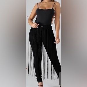 Black jeans with black long fringe in the front